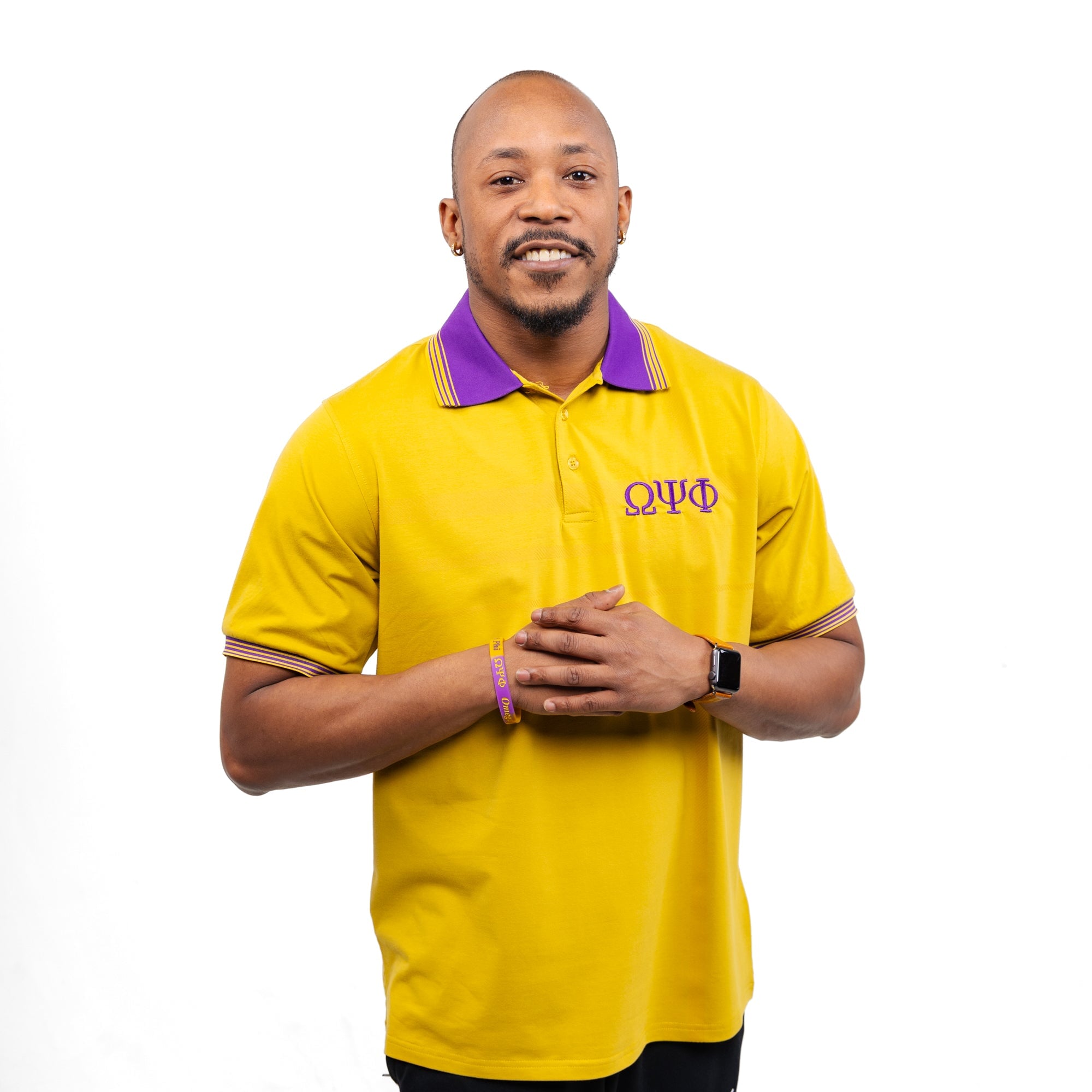 Gold Omega Psi Phi polo with purple collar Winters Industries