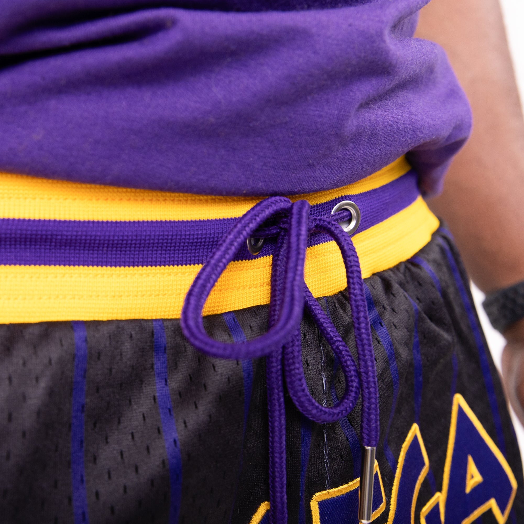 Omega Psi Phi Embroidered Black Shorts with Purple and Gold Stripes Shorts Winters Industries