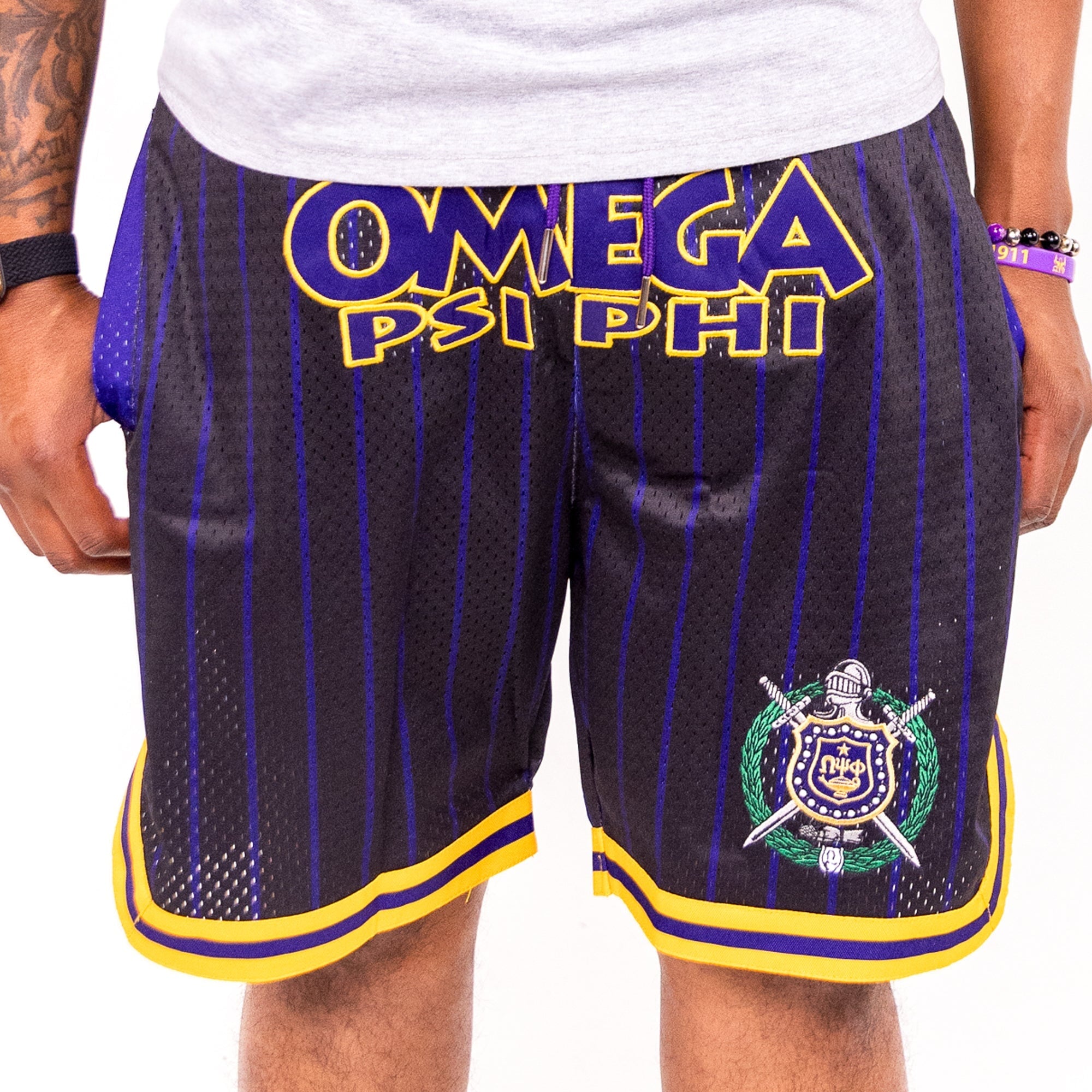 Omega Psi Phi Embroidered Black Shorts with Purple and Gold Stripes Shorts Winters Industries
