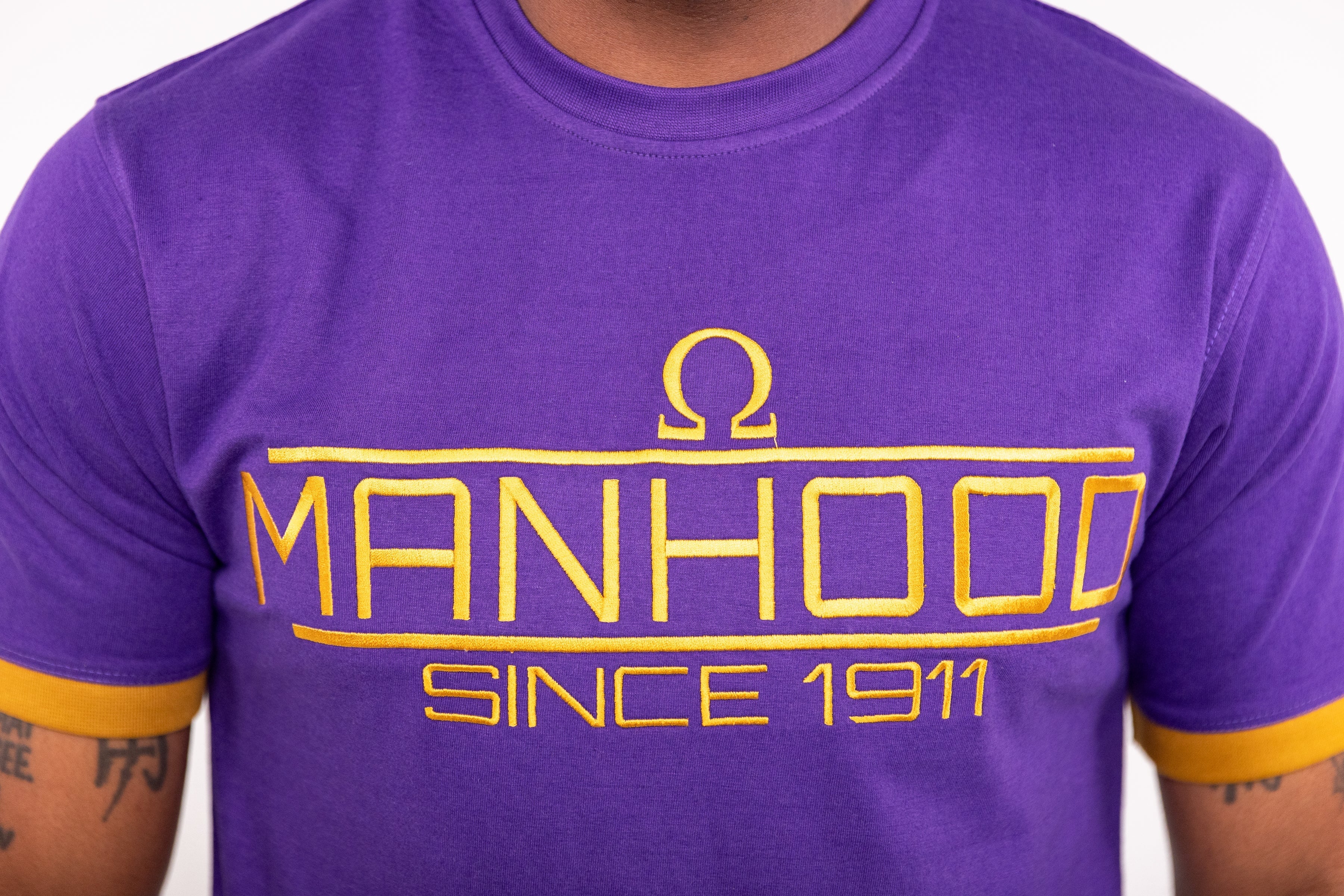 Omega Psi Phi "MANHOOD" Embroidered Tee Purple