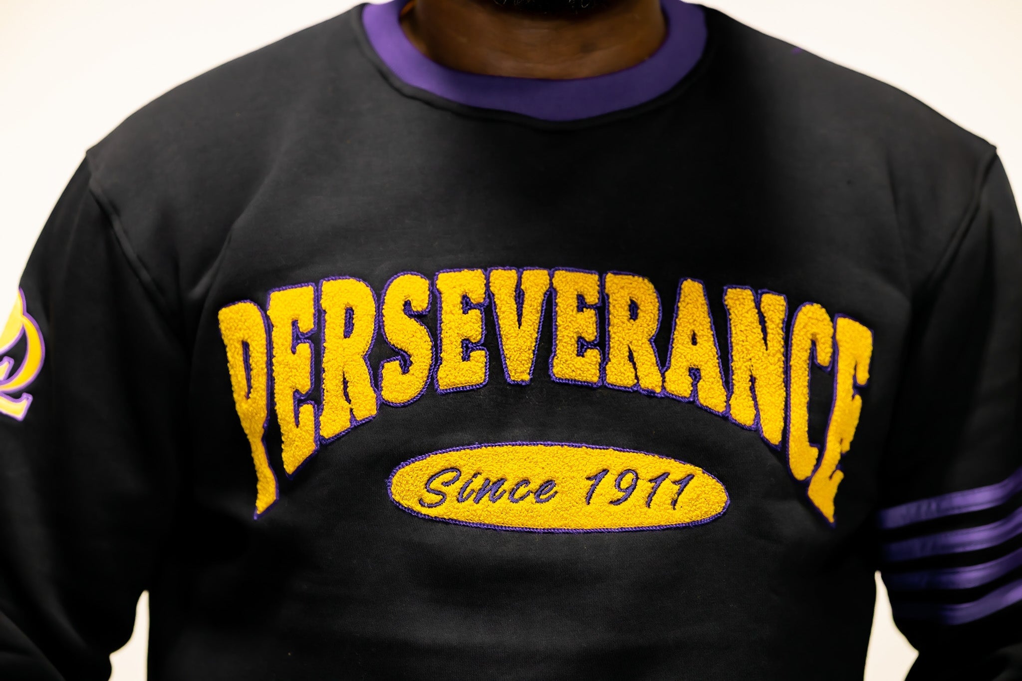 Omega Psi Phi "PERSEVERANCE" Chenille Sweater Black